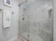 Spacious shower with marble tile and a built-in seat at 209 North Hillside Dr. # 201, North Myrtle Beach, SC 29582