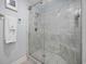 Large walk-in shower with marble tile and a built-in seat at 209 North Hillside Dr. # 201, North Myrtle Beach, SC 29582