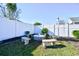 Charming fire pit area with stone benches in the backyard at 233 Cloverleaf Dr., Longs, SC 29568