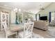 Dining room with light wood table, white chairs, and coastal decor at 2400 Kings Bay Dr. # 2400, North Myrtle Beach, SC 29582