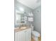 Bathroom with granite vanity, toilet, and a wall-mounted hair dryer at 300 N Ocean Blvd. # 1628, North Myrtle Beach, SC 29582