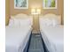 Two twin beds with white linens, neutral walls, and framed artwork at 300 N Ocean Blvd. # 1628, North Myrtle Beach, SC 29582