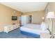 King size bed, dresser, and bathroom access at 300 N Ocean Blvd. # 1628, North Myrtle Beach, SC 29582