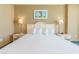 King bed with bedside tables and wall art at 300 N Ocean Blvd. # 1628, North Myrtle Beach, SC 29582