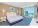 Ocean view bedroom with king-size bed and private balcony at 300 N Ocean Blvd. # 1628, North Myrtle Beach, SC 29582