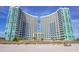 Oceanfront twin towers, featuring a curved design and multiple balconies at 300 N Ocean Blvd. # 1628, North Myrtle Beach, SC 29582