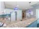 Well-equipped kitchen with granite counters and white cabinets at 300 N Ocean Blvd. # 1628, North Myrtle Beach, SC 29582