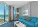 Living area with ocean view from sliding glass doors at 300 N Ocean Blvd. # 1628, North Myrtle Beach, SC 29582