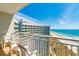 Balcony view of ocean, beach, and adjacent building at 300 N Ocean Blvd. # 1628, North Myrtle Beach, SC 29582