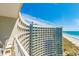 Balcony view of the curved building and the ocean at 300 N Ocean Blvd. # 1628, North Myrtle Beach, SC 29582