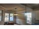 Bright dining room with coffered ceiling, two windows and a chandelier at 3057 Moss Bridge Ln., Myrtle Beach, SC 29579