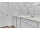 Double vanity bathroom with a large mirror and walk-in shower at 310 Sandridgebury Dr. # 40, Little River, SC 29566
