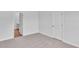Bedroom with carpet, white door and access to bathroom at 310 Sandridgebury Dr. # 40, Little River, SC 29566