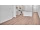 Open dining area with hardwood floors and kitchen views at 310 Sandridgebury Dr. # 40, Little River, SC 29566