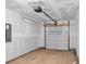 Empty garage with automatic garage door opener at 310 Sandridgebury Dr. # 40, Little River, SC 29566