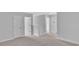Bright hallway with neutral walls and carpeted floors at 310 Sandridgebury Dr. # 40, Little River, SC 29566