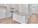 Open concept kitchen with granite countertops and stainless steel appliances at 310 Sandridgebury Dr. # 40, Little River, SC 29566