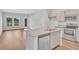 Modern kitchen with granite island, stainless steel appliances, and light cabinets at 310 Sandridgebury Dr. # 40, Little River, SC 29566
