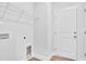 Laundry room with built-in shelving and a door at 310 Sandridgebury Dr. # 40, Little River, SC 29566