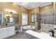 Elegant bathroom with double vanity, soaking tub, and walk-in shower at 3100 Lahinch Dr., Myrtle Beach, SC 29579