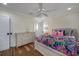 Bright bedroom with a floral comforter and built-in dresser at 33 Kings Ct., Myrtle Beach, SC 29572