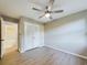 Bright bedroom with ceiling fan, hardwood floors, and spacious closet at 3783 Sweetgum St. # 3783, Myrtle Beach, SC 29577