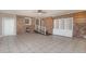 Sunroom with tile floor, brick wall, and built-in shelving at 407 Walnut Ave., Georgetown, SC 29440