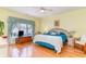 Bright bedroom with a king-size bed, hardwood floors, and large window at 44 Hamby Dr., Pawleys Island, SC 29585