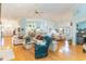 Open living space with hardwood floors, neutral decor and access to kitchen at 44 Hamby Dr., Pawleys Island, SC 29585