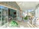 Spacious sunroom with wicker furniture and glass sliding doors at 44 Hamby Dr., Pawleys Island, SC 29585