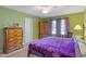 Bedroom with a king-size bed and large wooden armoire at 4490 Bradford Circle, Myrtle Beach, SC 29588