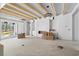 Open living room with exposed beams, large windows, and a built-in entertainment center at 450 Seabury Ln., Myrtle Beach, SC 29579