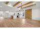 Open concept kitchen with white cabinets, island, and wood feature wall at 534 War Eagle Ct., Conway, SC 29526