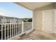 Private balcony overlooks a tranquil waterway, complete with a white railing at 6253 Catalina Dr. # 231, North Myrtle Beach, SC 29582