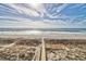 Scenic beach access with a wooden boardwalk leading to the sand at 6253 Catalina Dr. # 231, North Myrtle Beach, SC 29582