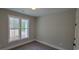 Bright bedroom with carpet and large window at 681 Hawthorn Dr., Pawleys Island, SC 29585