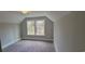 Bright bedroom with carpet flooring and large window at 681 Hawthorn Dr., Pawleys Island, SC 29585