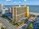 Aerial view of beachfront property with pool and parking at 6900 N Ocean Blvd. # 1540, Myrtle Beach, SC 29572