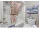 Bathroom with tub, shower, and coastal decor at 6900 N Ocean Blvd. # 1540, Myrtle Beach, SC 29572