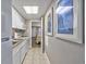 Small kitchen with white cabinets and granite countertops at 6900 N Ocean Blvd. # 1540, Myrtle Beach, SC 29572