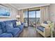 Living room with ocean view and comfortable seating at 6900 N Ocean Blvd. # 1540, Myrtle Beach, SC 29572