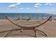 Relaxing ocean view with hammock and patio furniture at 6900 N Ocean Blvd. # 1540, Myrtle Beach, SC 29572