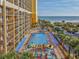 Elevated view of resort pool, water features, and beach at 6900 N Ocean Blvd. # 1540, Myrtle Beach, SC 29572