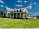 Community clubhouse with metal roof and large lawn at 718 Macon Alley, Myrtle Beach, SC 29588