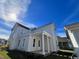 Two-story house with side porch and white siding at 718 Macon Alley, Myrtle Beach, SC 29588