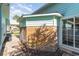 Brick and teal house exterior showing a side view with walkway at 827 Brenda Pl., Myrtle Beach, SC 29577