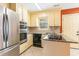 Charming kitchen with light-colored cabinets and granite countertops at 827 Brenda Pl., Myrtle Beach, SC 29577