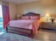 Well-lit bedroom with a queen-size bed, nightstands, and wood floors at 8500 Margate Circle # 209, Myrtle Beach, SC 29572