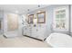 Elegant bathroom with double vanity, soaking tub, and walk-in shower at 160 Shipmaster Ave., Pawleys Island, SC 29585