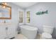 Bathroom features a freestanding tub and updated fixtures at 160 Shipmaster Ave., Pawleys Island, SC 29585